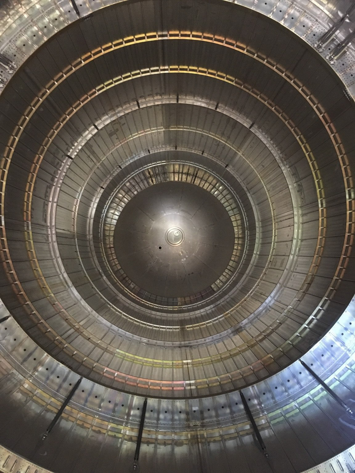 A peek inside the metallic, cylindrical, ribbed liquid hydrogen tank of the external tank