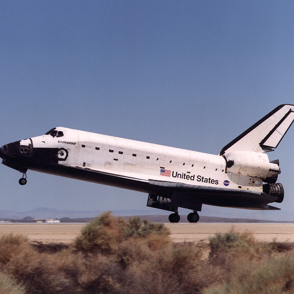 Space shuttle Endeavour lands in the California desert at Edwards Air Force Base