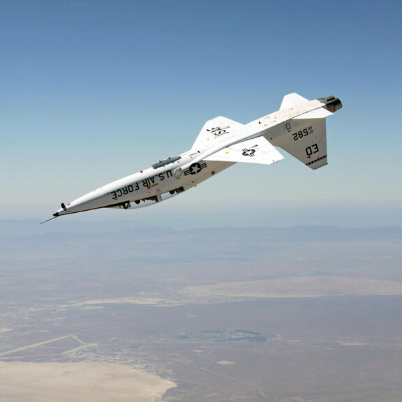 A T-38 Talon jet flies upside down