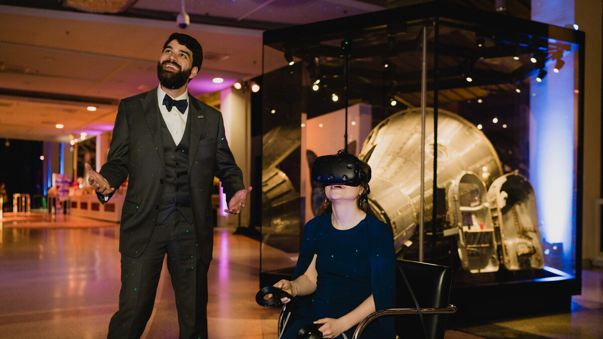 Discovery Ball guests enjoying Virtual Reality (VR) experience among the Mercury and Gemini space capsules