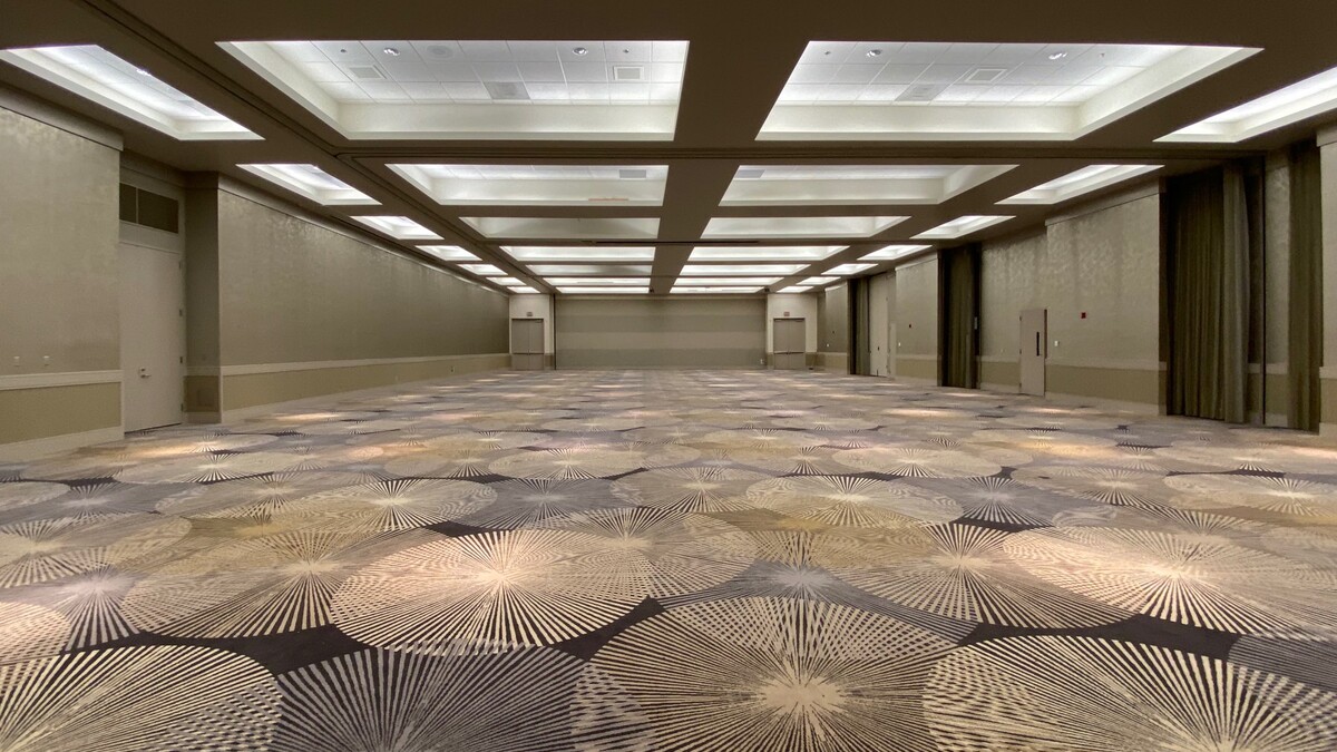 Empty Loker Conference Center with purple starburst carpet and recessed lighting