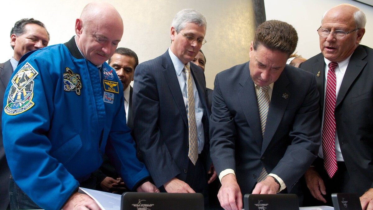 Papers being signed at Endeavour Title Transfer Event