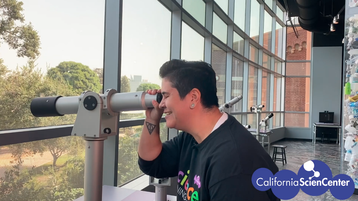 Educator Monica using telescope in LA Zone