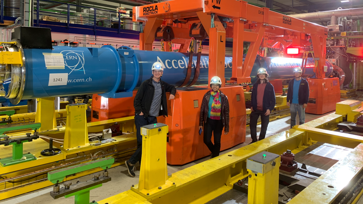 Four astrophysicists inspecting an engine in Secrets of the Universe 3D