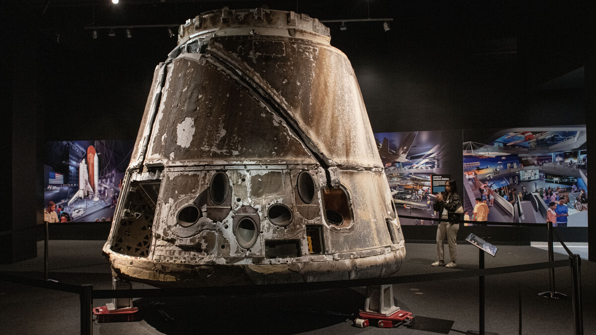 A SpaceX Dragon cargo spacecraft inside the Work in Progress gallery