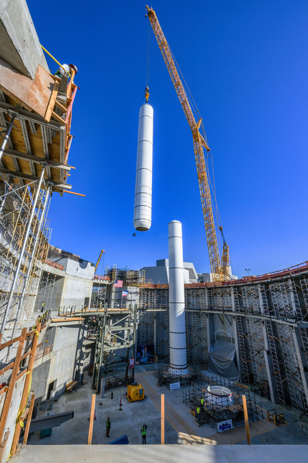 Solid rocket motor lifted by a crane into a construction site