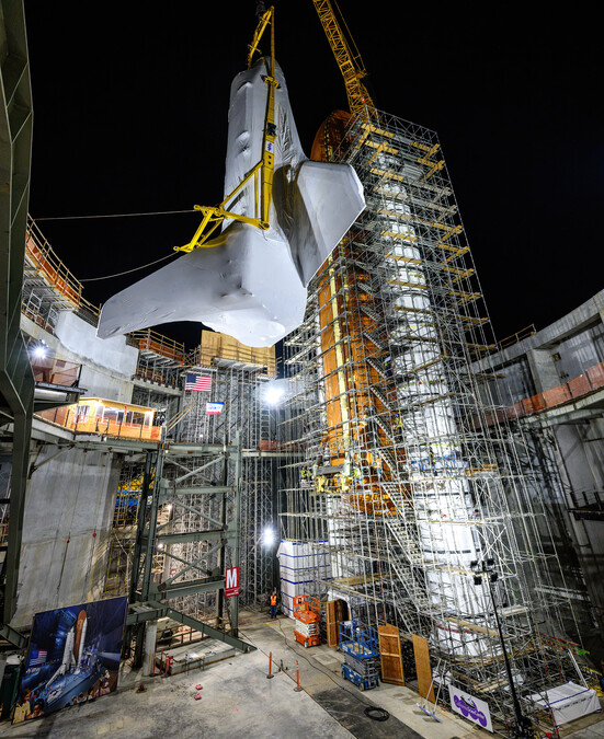 Space Shuttle Endeavour being lifted into Samuel Oschin Air and Space Center.