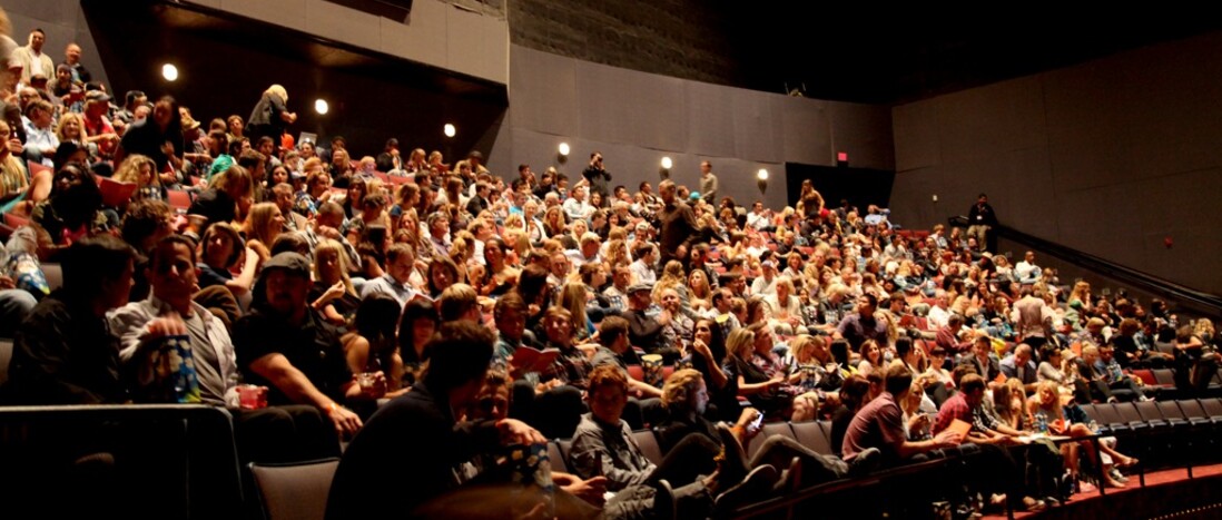 IMAX Theater seats filled with seated patrons